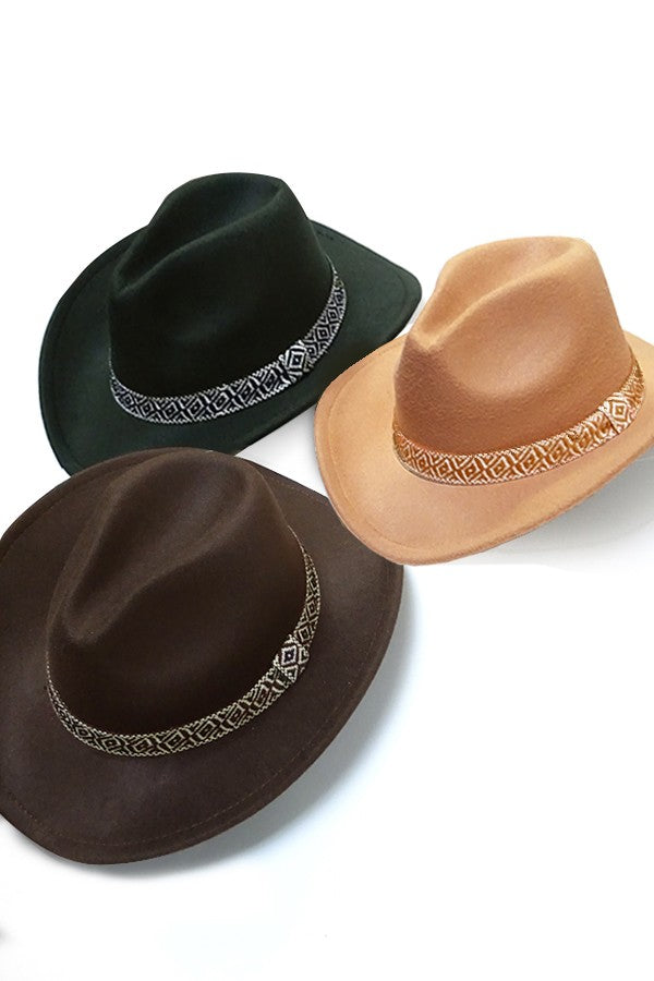 A VINTAGE CLASSIC COW BOY HAT WITH AZTEC TRIM